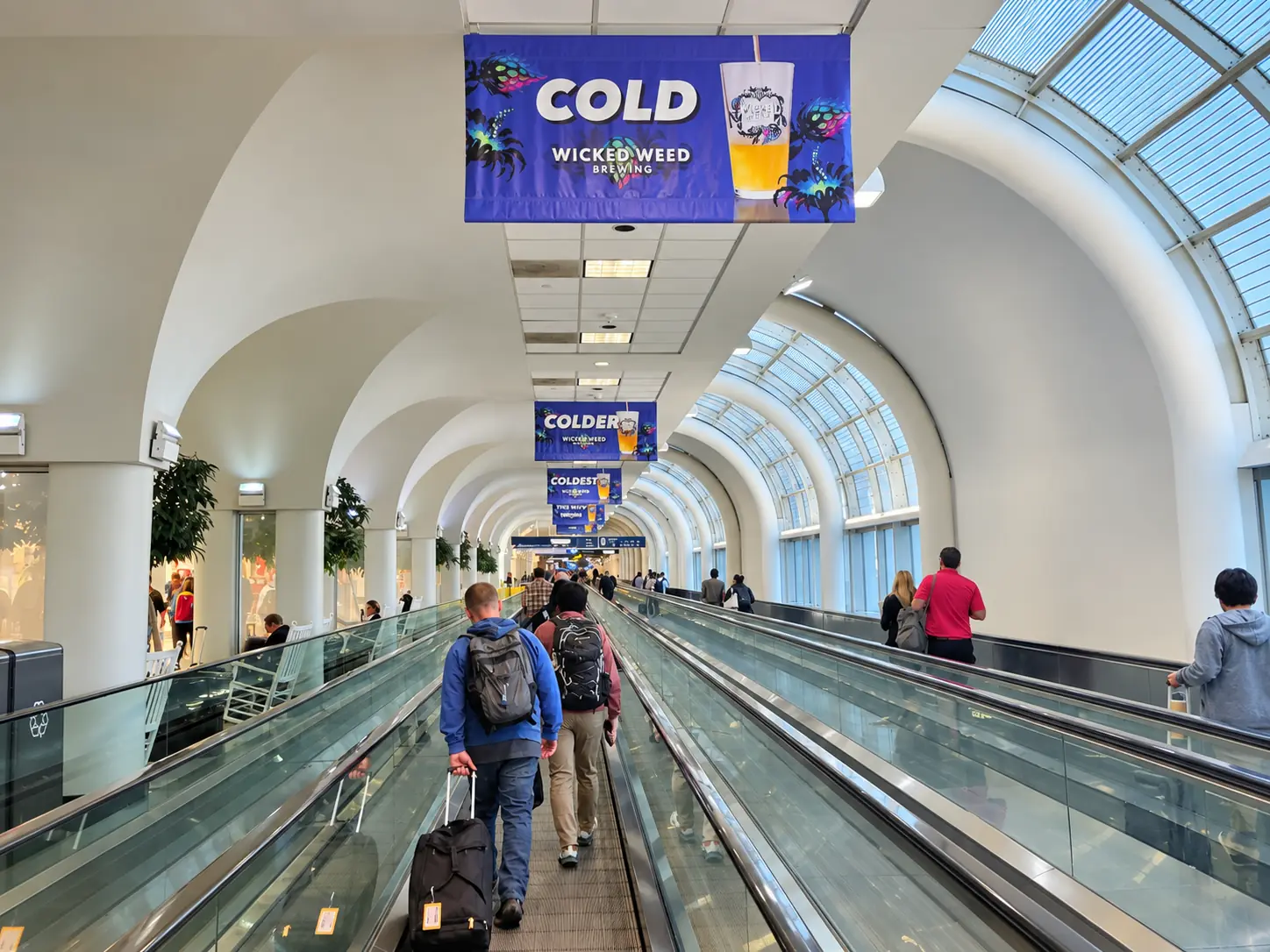 Example of overhead banner packages in an airport terminal